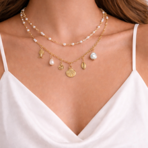 Charm necklace with elephant pearl shell and leaf pendants by Lumera