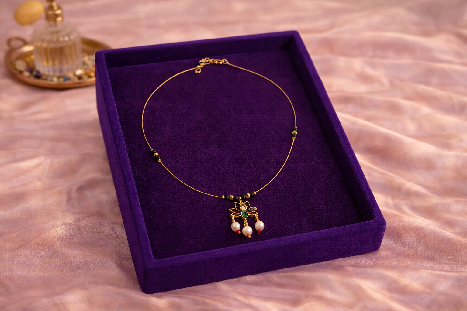 Invisible Mangalsutra Lotus Pendant Gold Tone | Lumera Invisible mangalsutra with lotus pendant pearl drops and black beads by Lumera