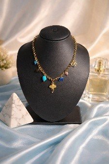 Elephant Pendant Charm Necklace Blue Stone | Lumera Gold elephant pendant charm necklace with blue stone and cross charms by Lumera