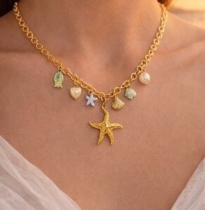 Gold starfish charm necklace with pastel ocean charms and pearl by Lumera