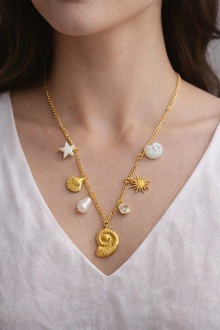 Golden Spiral Shell Charm Necklace Big | Lumera Gold big spiral shell charm necklace with ocean charms and pearl by Lumera