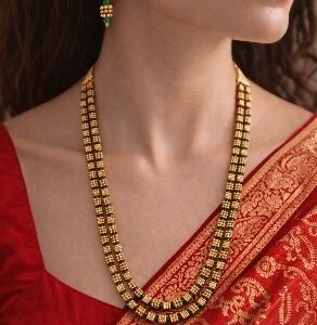 Gold green square mani layered necklace and earring set worn with red silk saree – Luméra