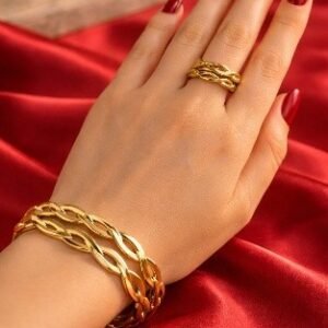 Home Gold infinity kada bracelet with matching ring and hoop earrings set by Lumera