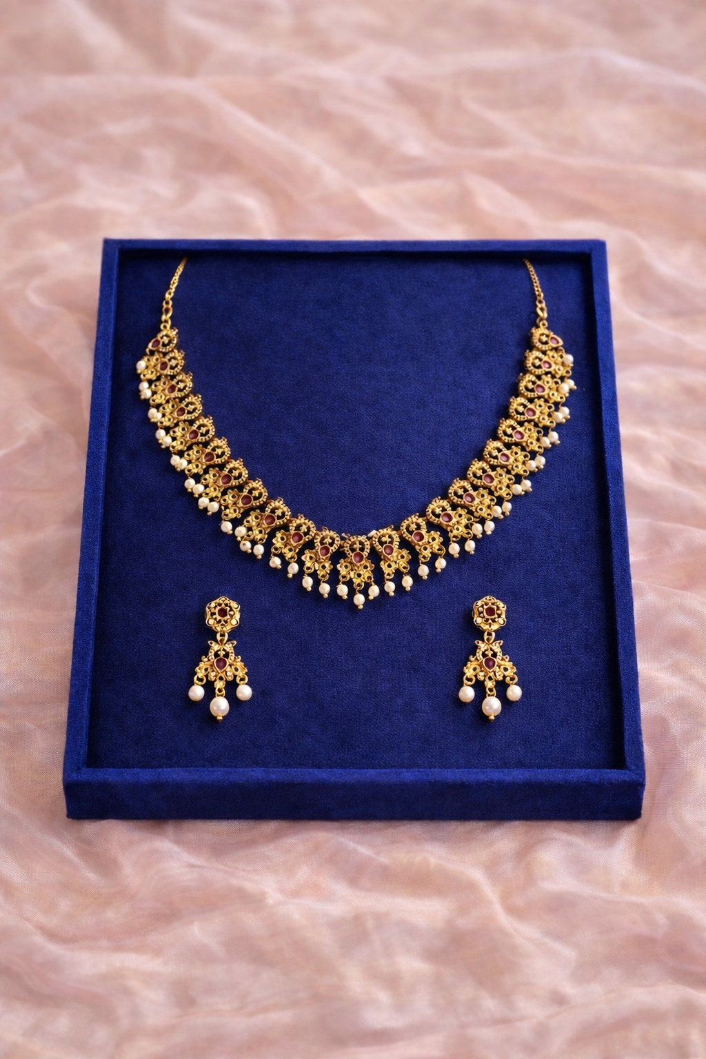 Elegant Moti Necklace | Lumera Gold elegant moti necklace set with ruby stones and pearl drops with matching earrings by Lumera