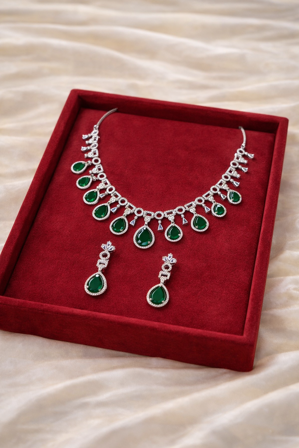 Silver Green Emerald Necklace | Lumera Woman wearing silver emerald necklace set with matching earrings by Lumera